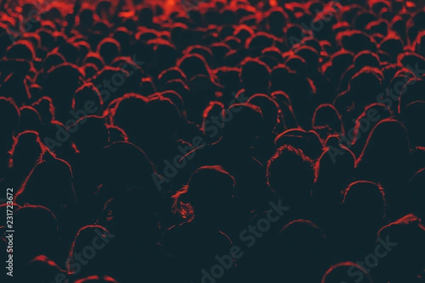 Fototapeta Colorful crowd of people of a big music festival in a stage lights as a beautiful background