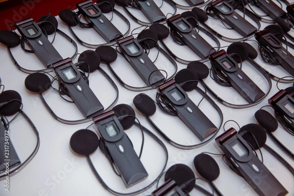 Fototapeta headphones used for simultaneous translation equipment simultaneous interpretation equipment . A set of headphones for simultaneous translation during negotiations in foreign languages.