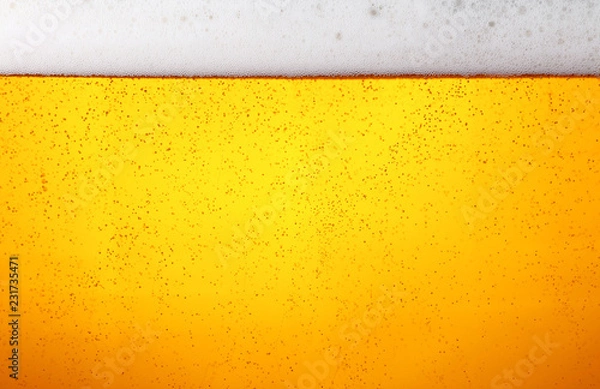 Obraz Close up background of beer with bubbles in glass