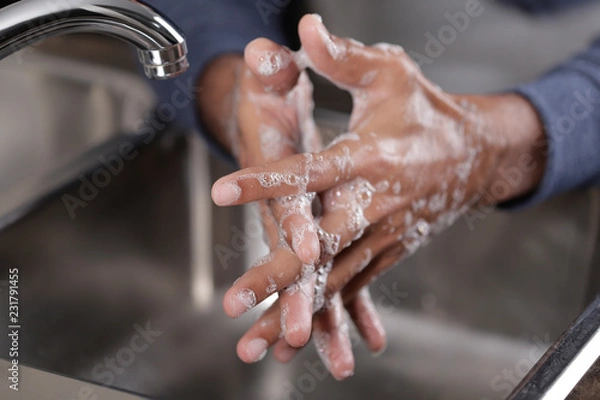 Obraz Washing hands with soap and water at the faucet, Hygiene concept