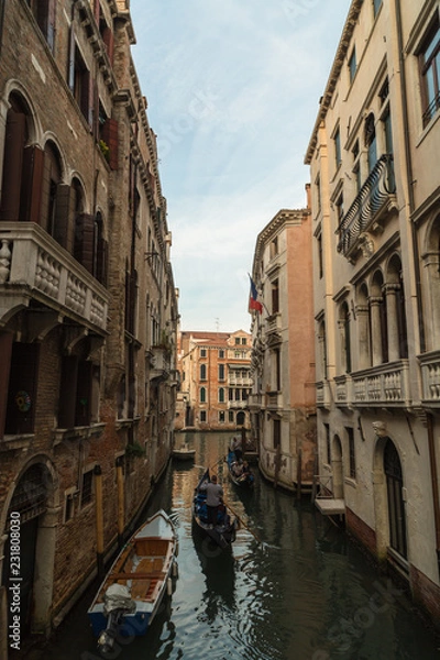 Obraz Two gondola with passengers in tight canal in Venice