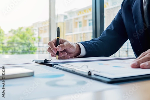Fototapeta Business team meeting present. Professional investor working with new startup project. Digital tablet laptop computer design smart phone in office.
