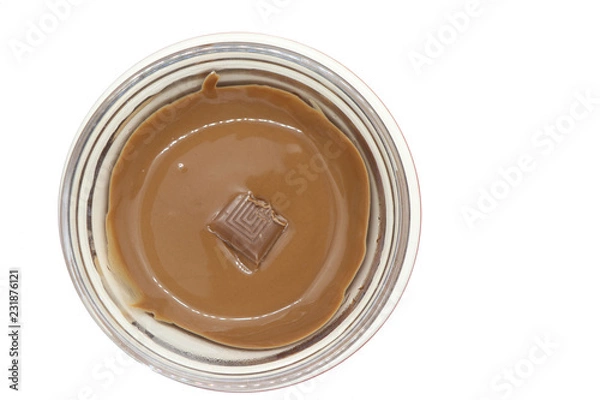 Fototapeta Aerial view of melted chocolate in glass jar