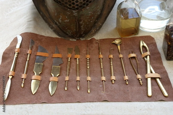 Obraz Various ancient Roman scalpels and other surgical instruments made from brass and steel