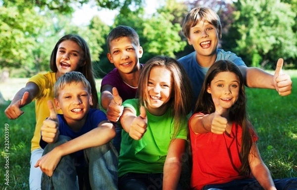 Obraz Happy smiling  diverse kids hugging in park