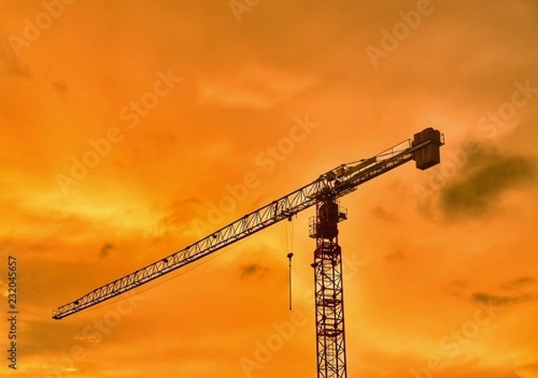 Obraz Crane at orang sky
