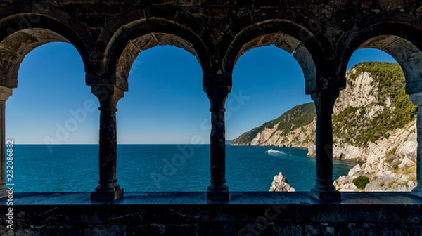 Fototapeta Stunning views of the sea through the external colonnade of the Church of San Pietro in Portovenere, Liguria, Italy