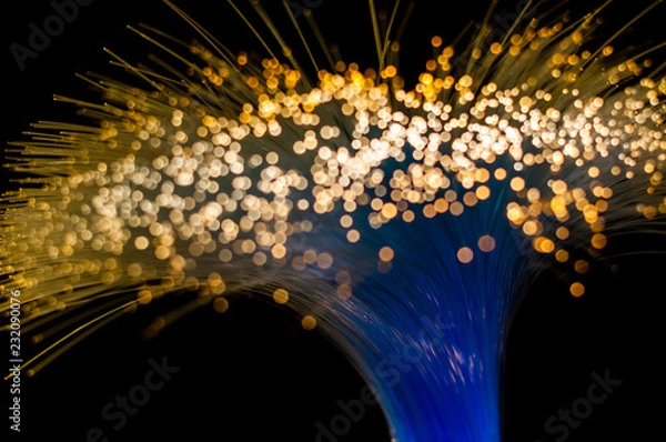 Obraz Twisted bundle of optical fibers transmitting electrical light