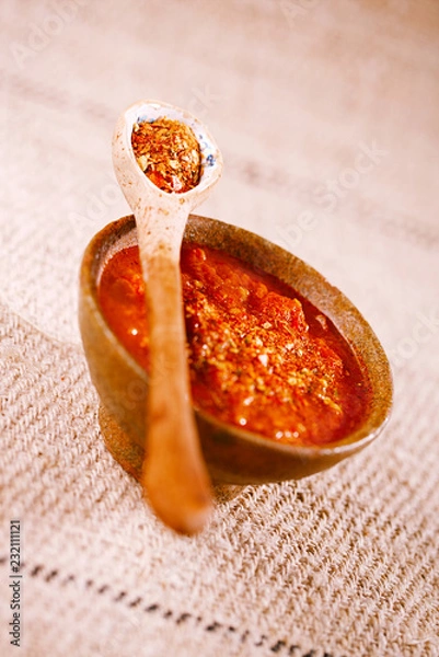 Fototapeta Calabrian Chilli Pepper flakes with jambalaya chicken soup