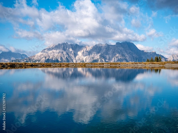 Fototapeta Image of mountain panorama with water reflections in lake