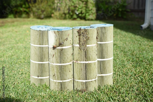 Fototapeta Dirty pool filters removed from swimming pool to clean