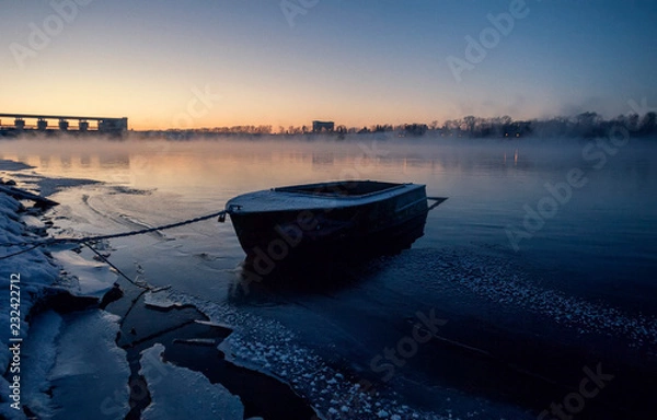 Obraz The boat on the river bank Volga.