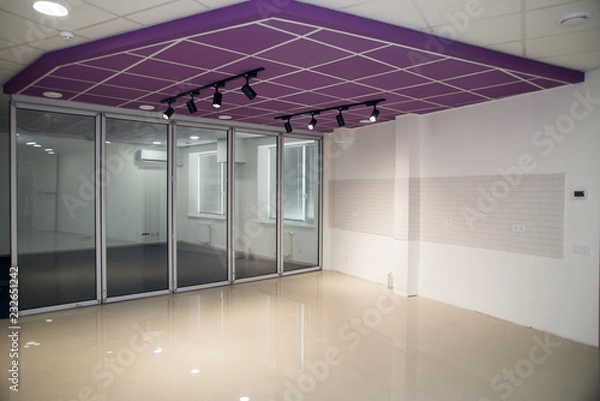 Fototapeta False celling with lamps. Modern design. Illumination in hall. Construction background