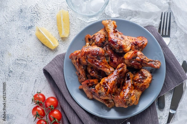 Fototapeta baked chicken pieces in teriyaki sauce, closeup, top view, copy space