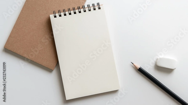 Fototapeta open blank spiral notebook with pencil and eraser on white background.Empty Space for your text.