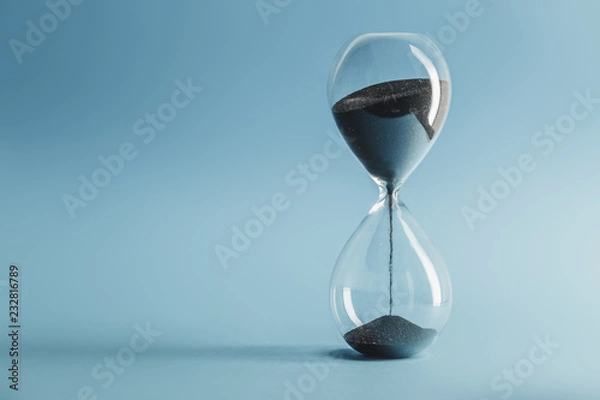 Obraz Hourglass on blue background