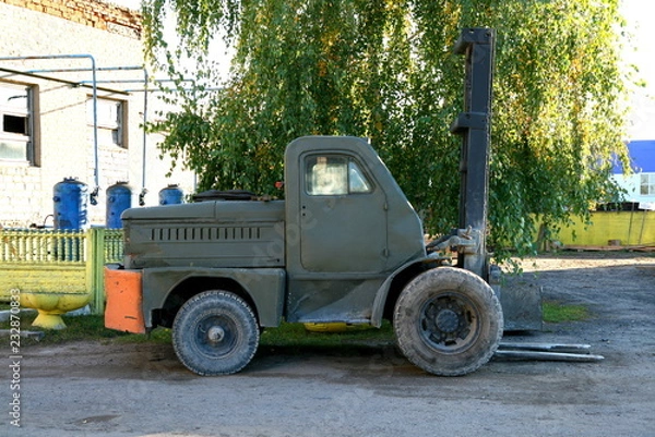 Obraz Old car loader. Side view.