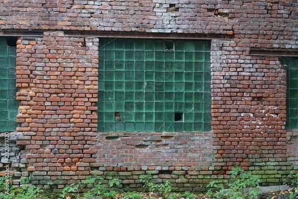 Fototapeta the window is opaque, made of glass bricks. in a brick structure.