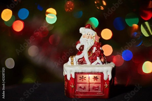 Fototapeta Santa Claus statuette doing an exercise waiting for Christmas
