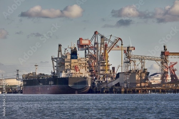 Obraz Industrial harbor with rusty structures