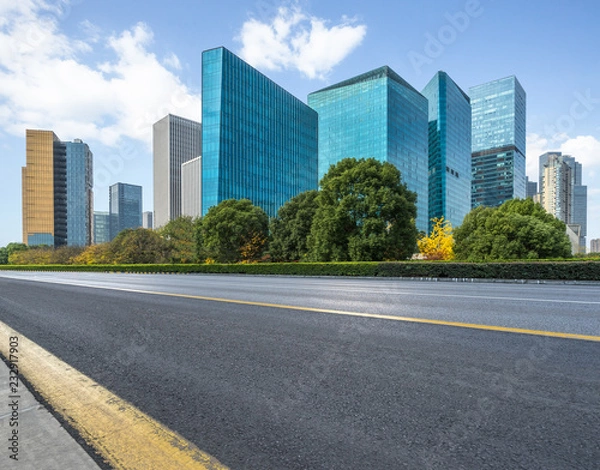 Fototapeta empty asphalt road with city skyline background in china.