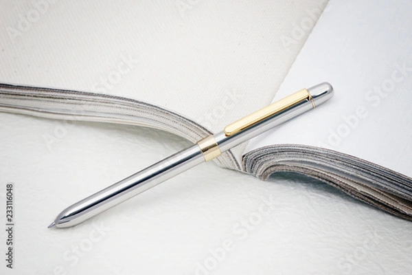 Fototapeta a silver pen on paper