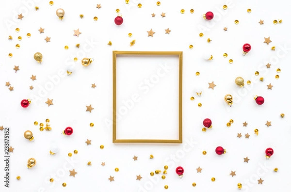Obraz Wooden christmas decoration, gold photo frame, red balls on white background, flatl ay, top view