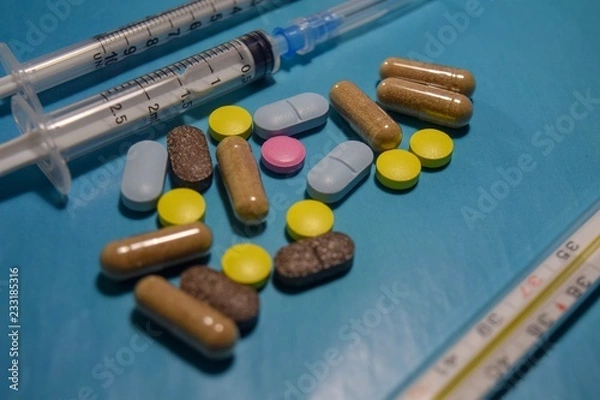 Obraz pills on blue background