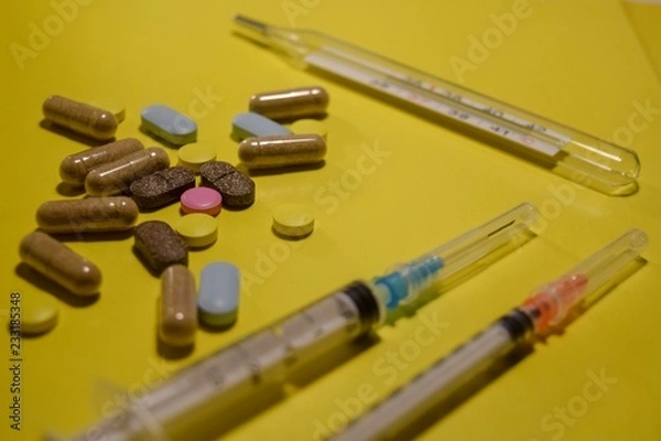 Obraz pills on yellow background
