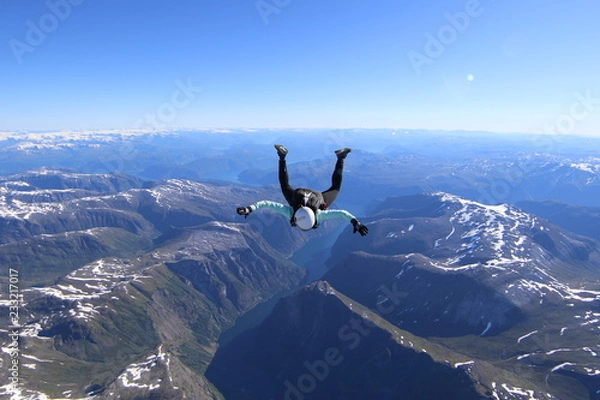 Fototapeta Wingsuti skydiving over Norway
