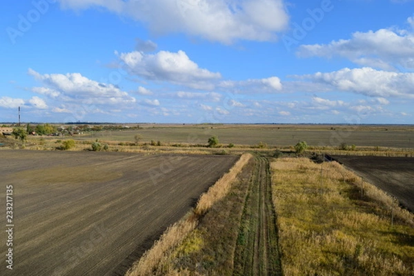 Fototapeta plowed field in the spring in the village. Agricultural land in the Kuban. Preparation of fields for sowing wheat