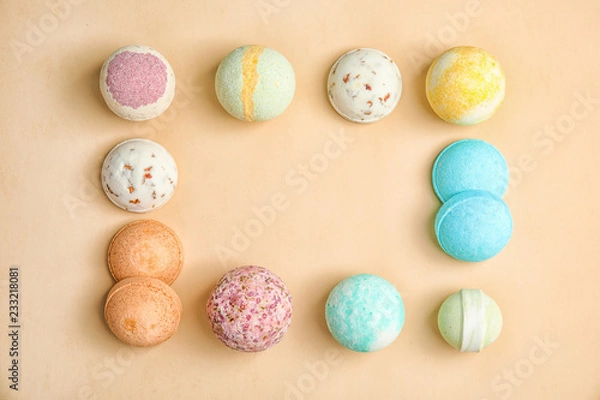 Fototapeta Flat lay composition with bath bombs and space for text on color background