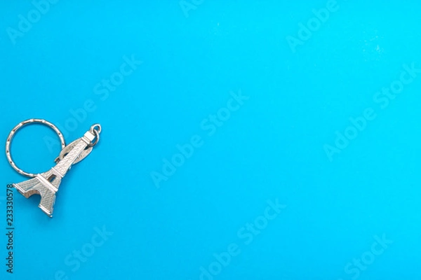 Obraz Eiffel tower model on Blue paper