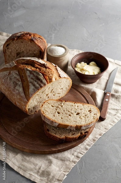 Fototapeta Artisan sliced toast bread with butter and sugar on wooden cutting board
