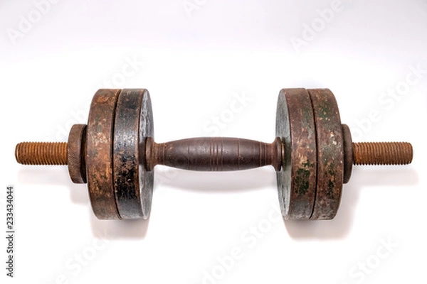 Fototapeta Old rusty dumbbell on a white background
