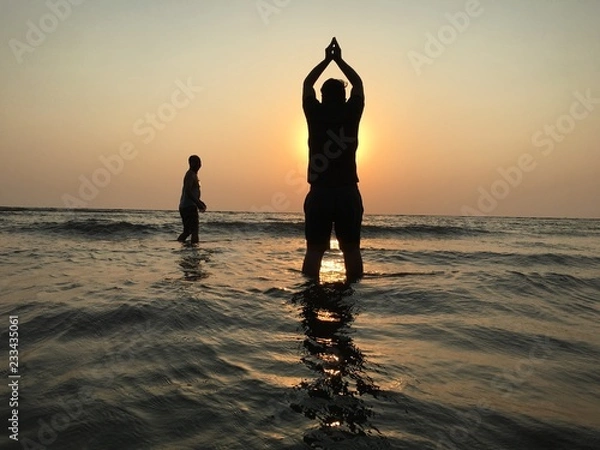 Obraz Suryanamaskar on beach sunset