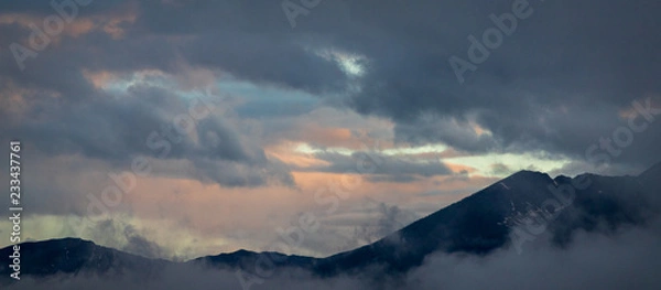 Fototapeta Panoramic Mountain Ridge and Dramatic Clouds at Sunset