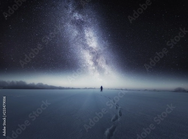 Obraz Starry night sky and man silhouette standing on snow