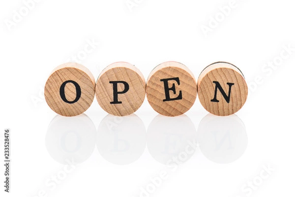 Fototapeta Word Open from circular wooden tiles with letters children toy.