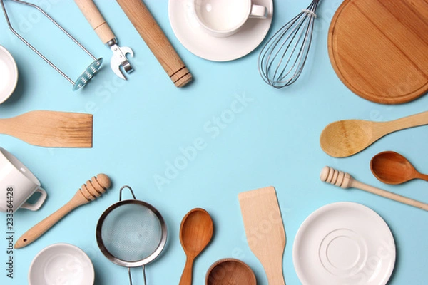 Fototapeta different kitchenware  on a colored background top view. Cooking appliances.