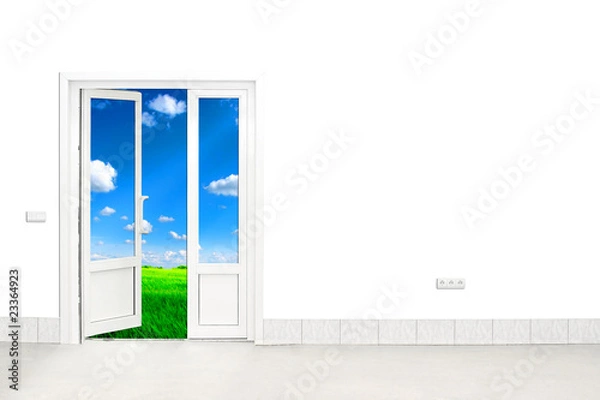 Fototapeta open door with sky and green field in the background