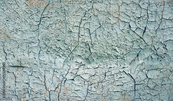 Obraz Abstract blue, beige and turquoise background wallpaper texture. Old flaky paint peeling off grungy cracked wall. Cracks, scrapes, peeling old paint and plaster on background of old cement wall.