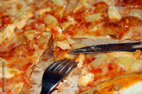 Obraz appetizing pizza cut by knife and fork