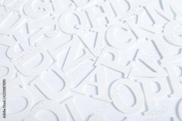 Obraz  White wooden alphabet letters top view on white background