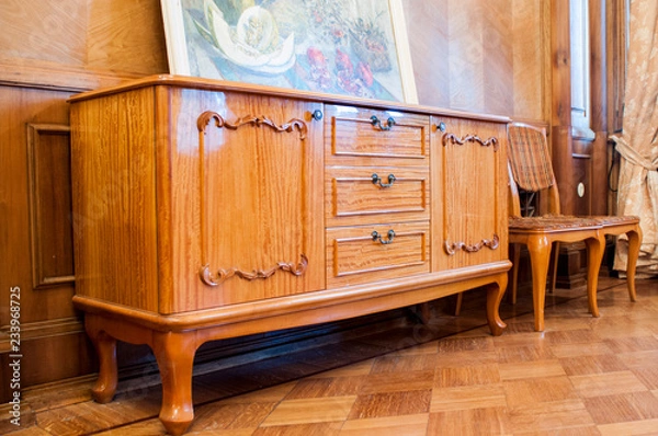 Fototapeta Vintage wooden chest of drawers in retro style