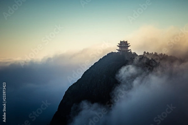Obraz Buddhist temple showing through fog and clouds on mountain top, Emei Mountain, China