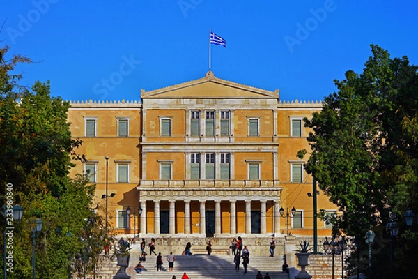 Fototapeta Athens, Greece - October 06, 2014 People walking in Syntagma square with the Greek parliament building as a background