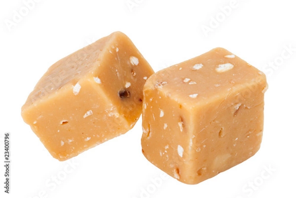 Obraz Gestapelte hellbraune Fudge mit Haselnuss