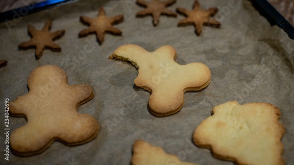 Fototapeta Christmas cookies on baking tray. Gingerbread cookies. Chritsmas concept.