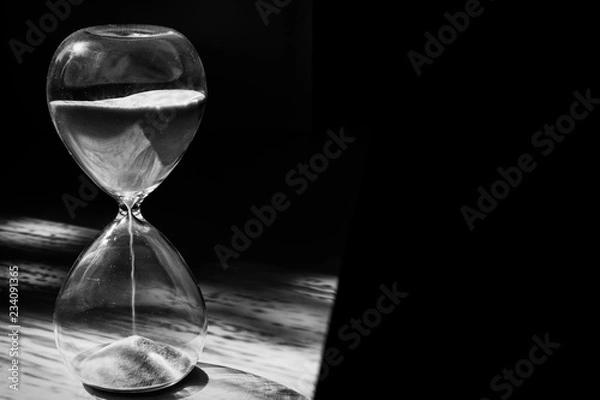 Obraz Hourglass on black background